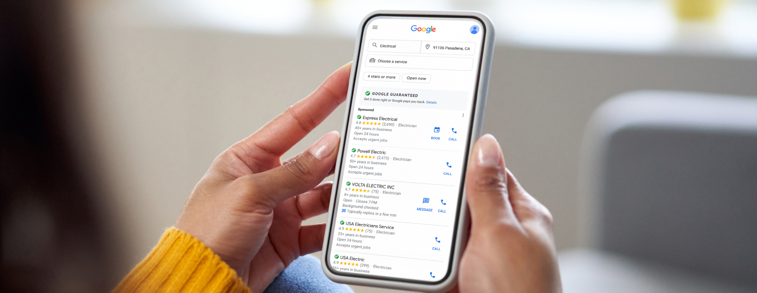 Image of a person scrolling Google ads on their phone