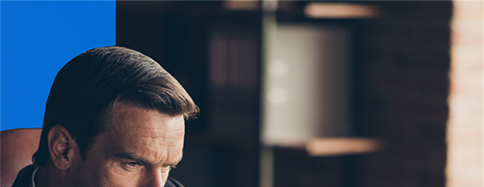 Businessman looking pondering something on his laptop