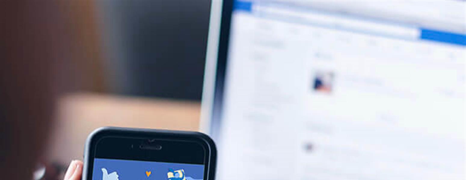image of person holding mobile phone