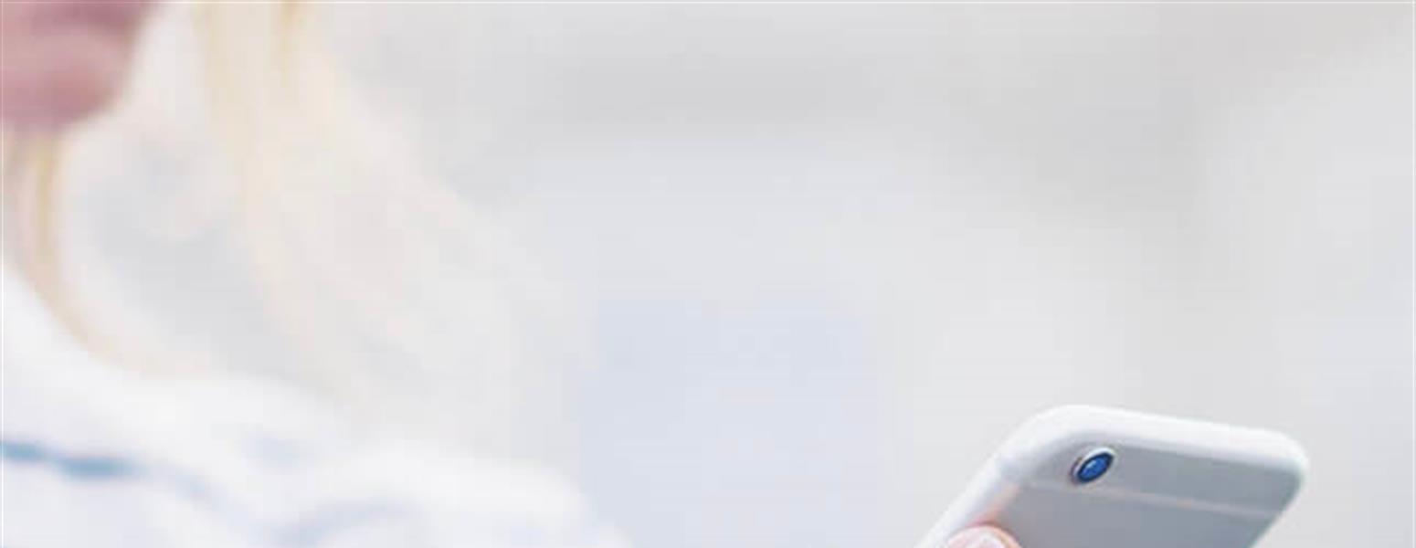 image of woman scrolling through mobile phone