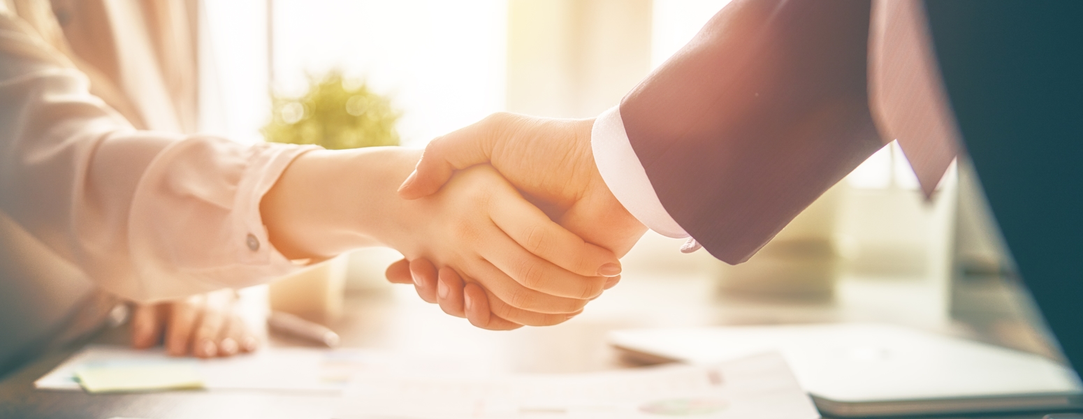 Man and woman shaking hands