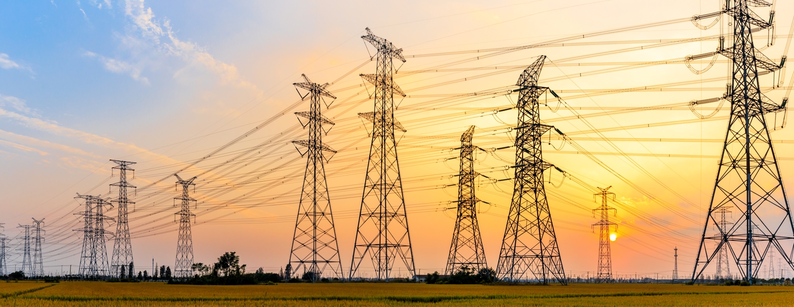 Image of power lines against a sunset