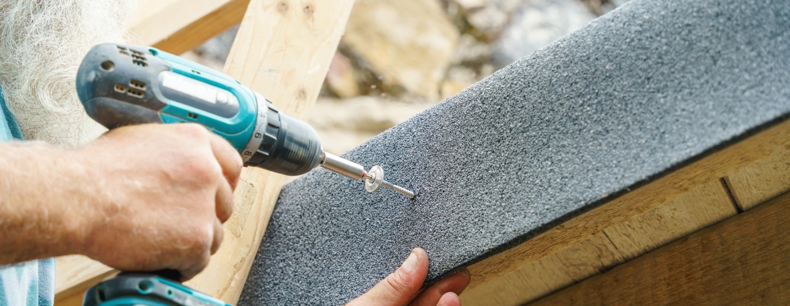 A worker working on a roof