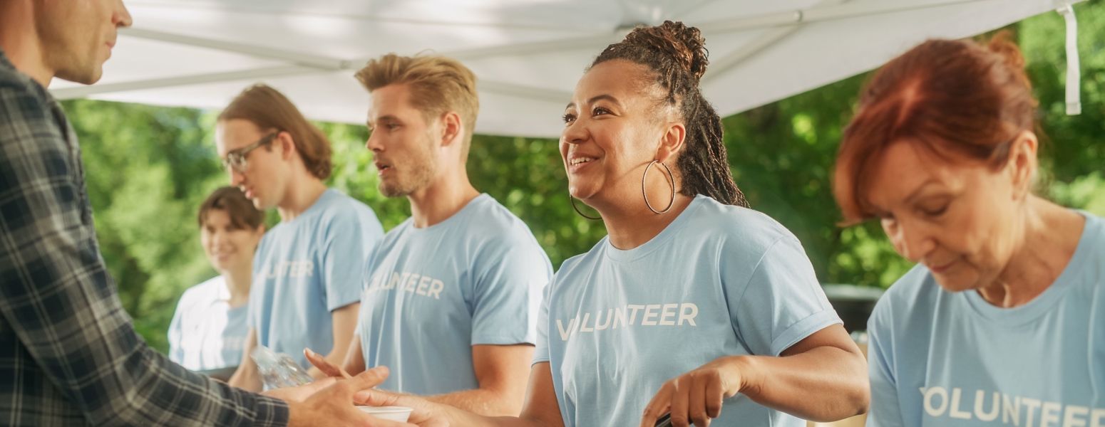 A group of volunteers passing out food