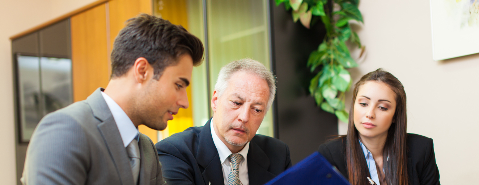 Two lawyers talking to a client