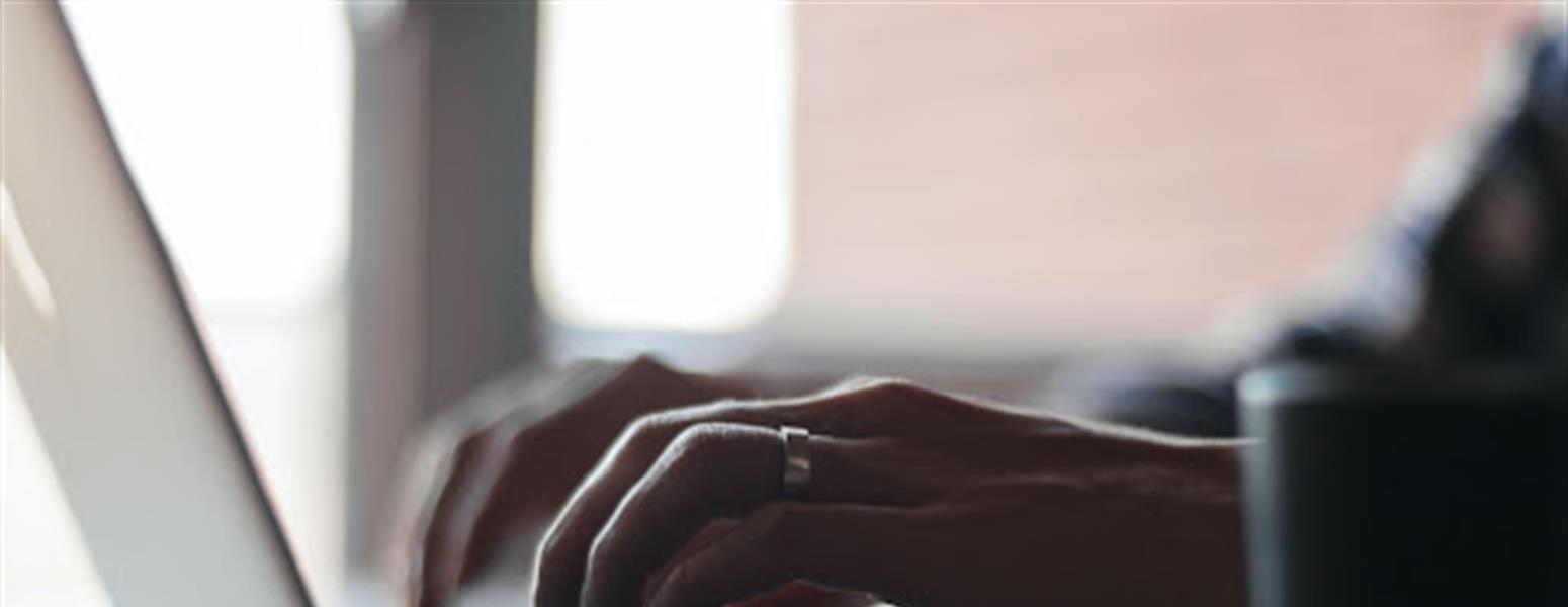 Hands doing email marketing on laptop