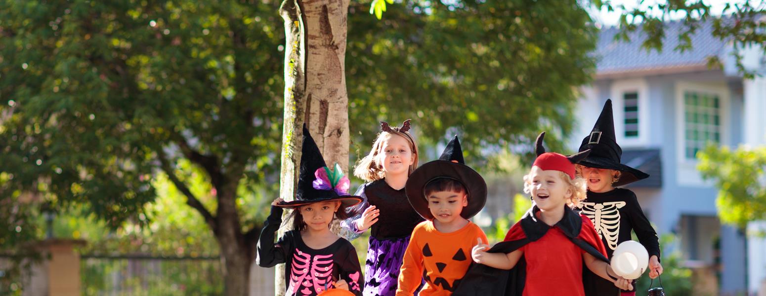 A group of kids go trick or treating