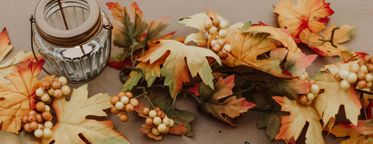 Fall foliage on a sign that says give thanks