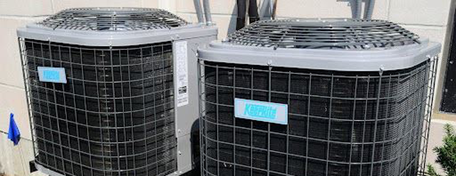 HVAC technicians repair AC