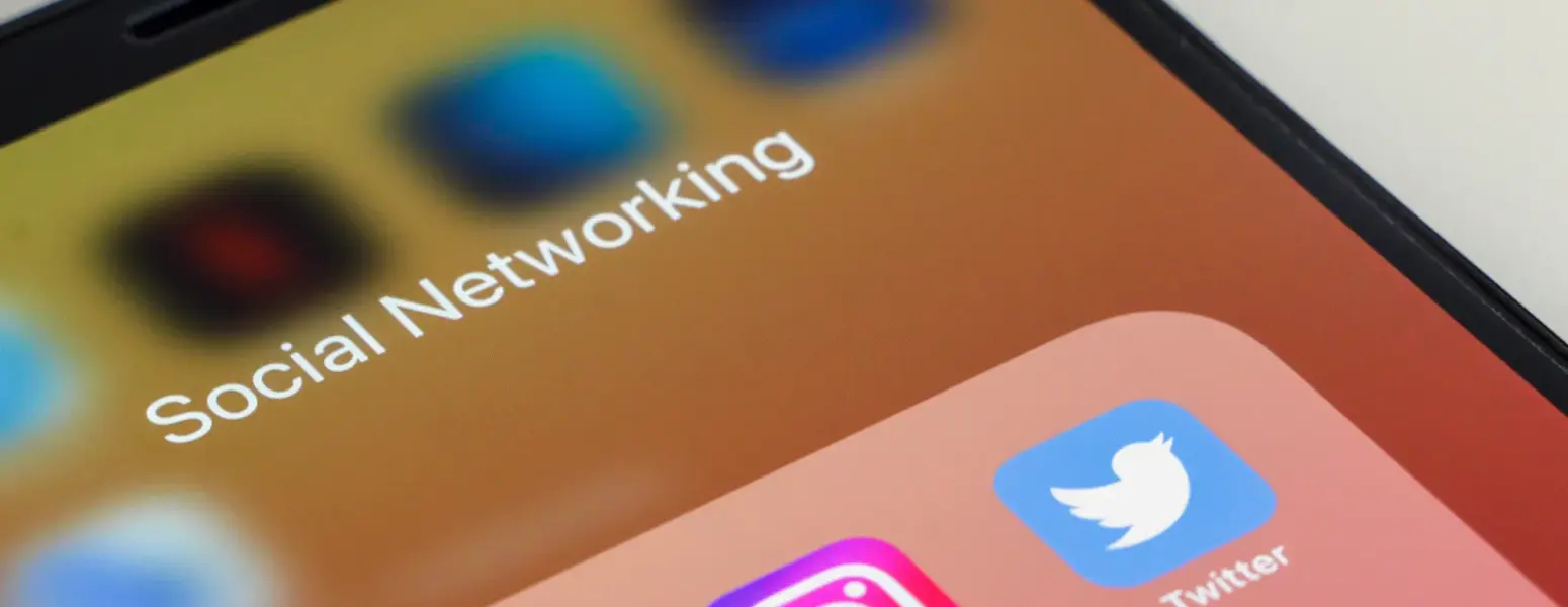 A mobile device showing social media icons