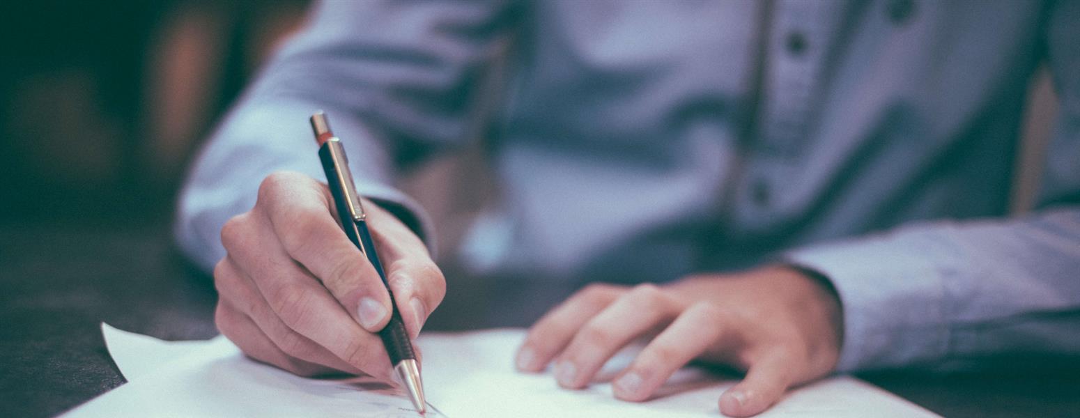 Man writing with a pen