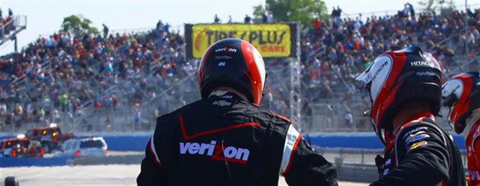 Pit crew working on a racecar on the track
