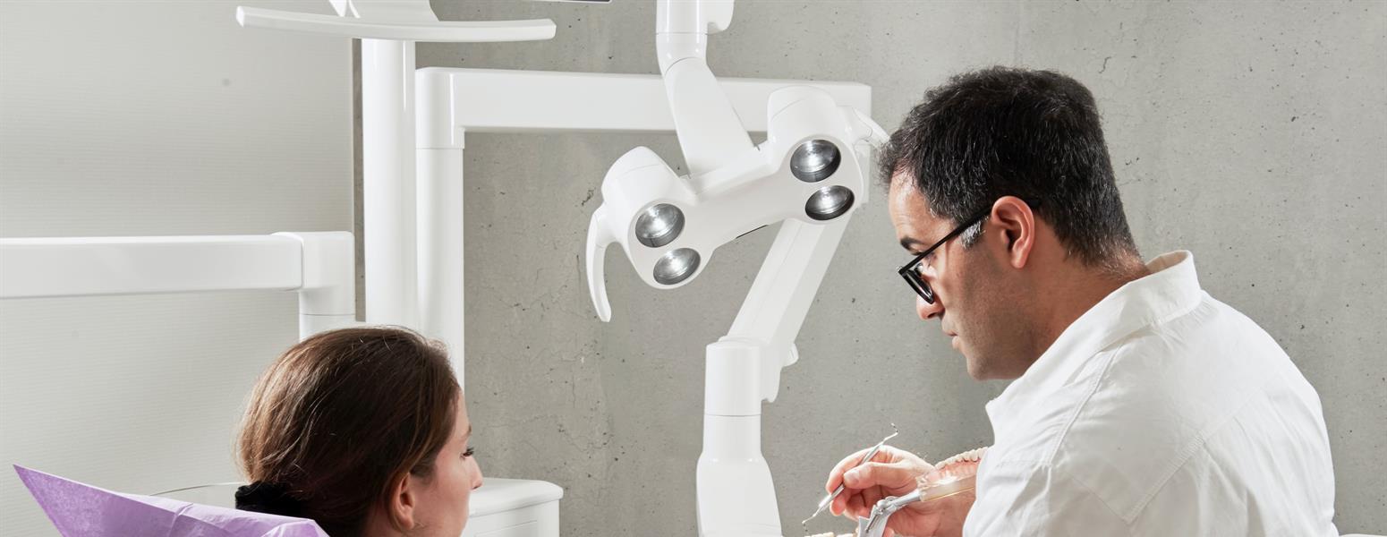 Dentist explaining to patient