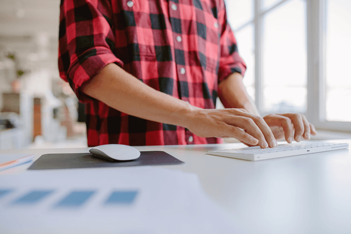 Man typing on a keyboard