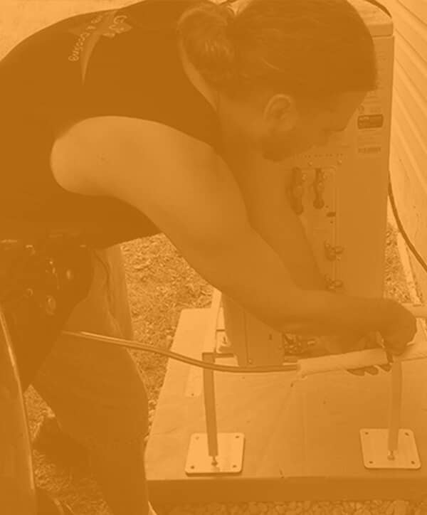 Technician working on HVAC item