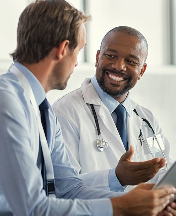 Doctors speaking with each other