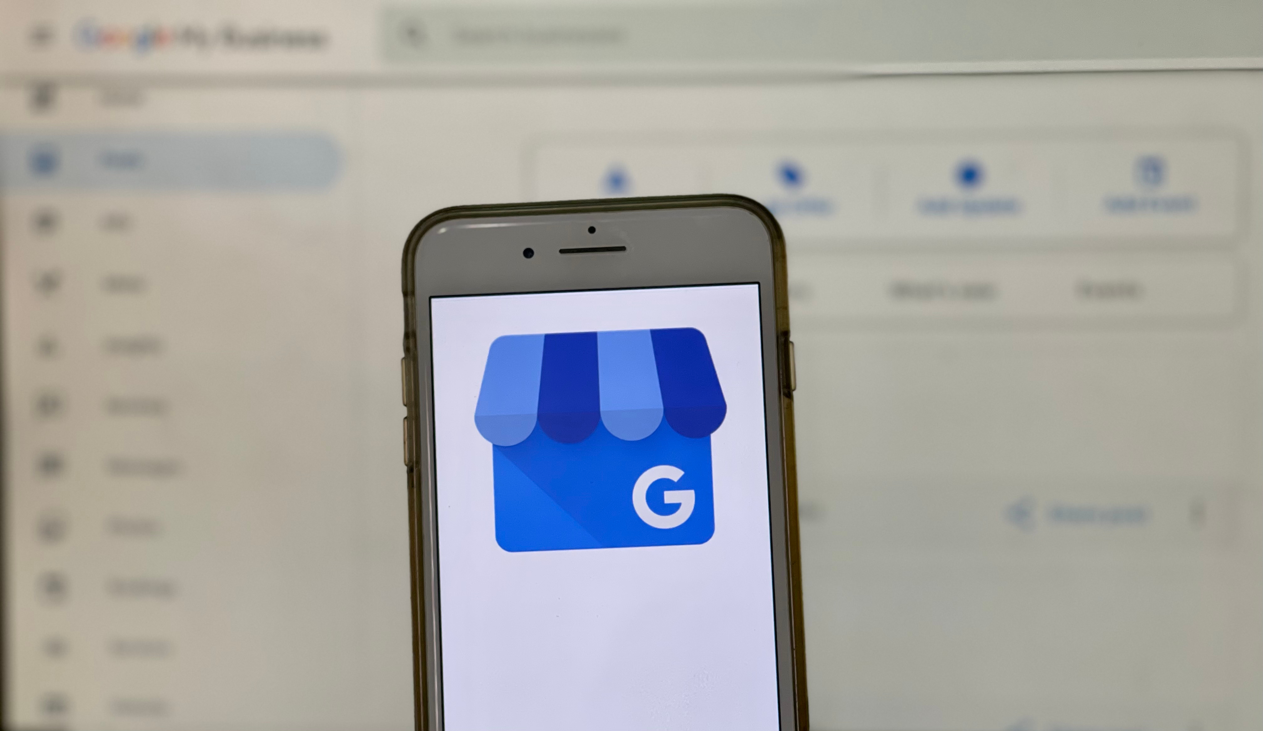 Image of a Google My Business page with a mobile phone in front