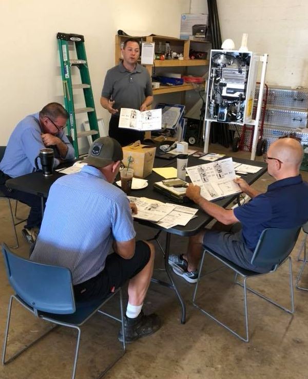 Ez Flow Plumbing staff going over some documents.