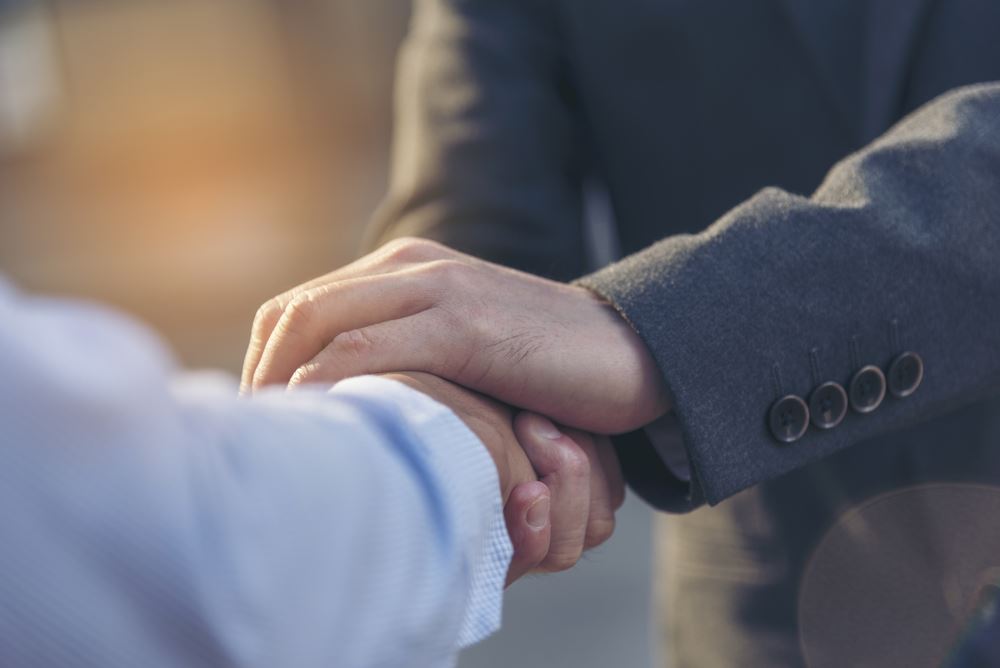 image of men shaking hands